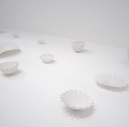 Hitomi Igarashi says these porcelain forms are much thinner than normal ones due to her process of casting them within folded paper shapes.